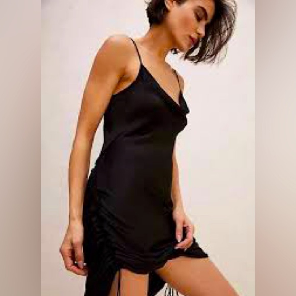 Free People black slip dress. Adjustable straps and cinching. Size Medium